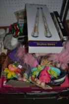 A box of children's toys, rhythm sticks etc