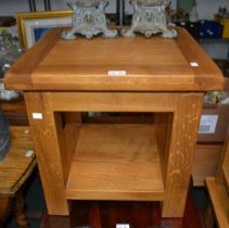 A small oak side table with under tier