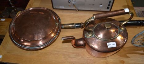 A copper kettle and a copper warming pan, with an ebonised handle