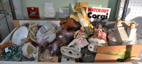 A drawer containing a selection of ceramics including dog figurines