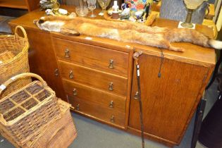 A mid century oak brake front sideboard