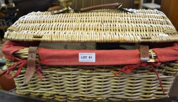 A woven wicker hamper with contents