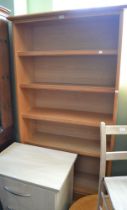 A modern light oak bookcase, having two drawers at base