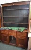 19th century small sized walnut dresser with plate rack back