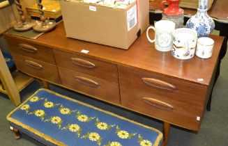 A retro design six drawer low side board unit