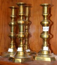 Five brass candlesticks