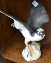 A Spode fine bone china model of an open winged osprey, hand painted with printed marks to underside