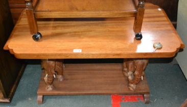 An African Ghana mahogany two-tier occasional table, elephant supports