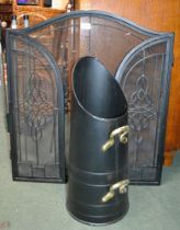 A metal twin fold spark guard with a coal scuttle