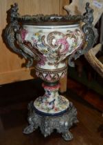 A possible 19th century metal and porcelain urn