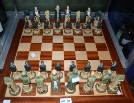 A Sherlock Holmes themed chess set on wooden board