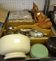 A box containing a selection of useful domestic items, decorative tiles, pestle and mortar, cutlery