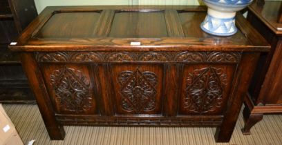 Quality re-pro oak coffer with carved panel front