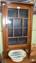 Small oak cabinet with bar glazed door