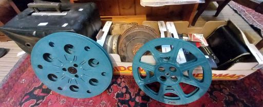 A pair of Bose speakers, various cameras, projector & film reels