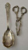 A pair of early Victorian cast silver sugar tongs, cast fruiting vine decoration, together with a st