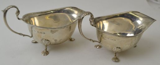 Ernest W Haywood, A pair of silver Georgian design sauce boats, with beaded rim, leaf mounted scroll