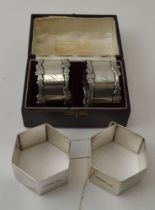H. Hunt, a pair of silver hexagonal napkin rings, one engraved Day the other Night, Sheffield 1943,