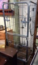 A large chrome finished mobile storage cage