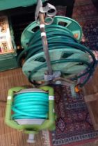 Two garden hoses on reels