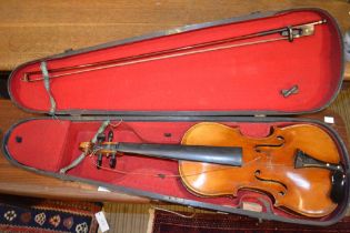A violin - ,Giovan Paolo Maggini label inside, with bow in a hard wooden case
