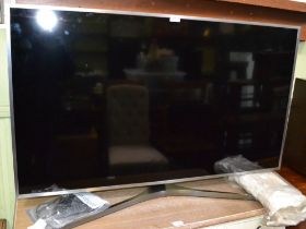 Samsung series six 49" flat screen tv on stand with remote