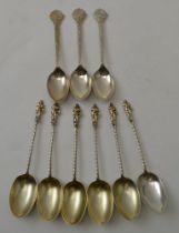 George Unite, a set of six silver apostle coffee spoons, Birmingham 1891 together with three Cooper
