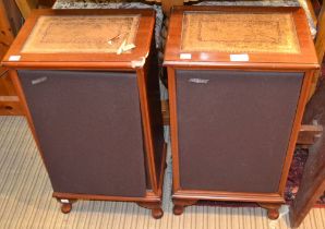A pair of Hacker speakers in mahogany cases