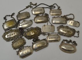 A collection of seventeen silver plated spirit labels, on chains, includes "Gin", "Rum", "Whisky", "