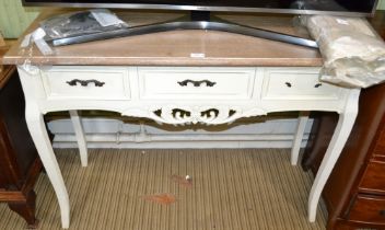 Part painted continental design side table with three drawers