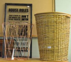 'House rules' glass sign and two laundry baskets