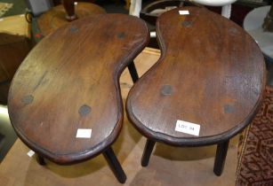 A pair of small kidney shaped stools