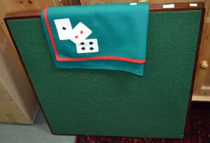 A baize covered card table with folding legs and associated cloth cover