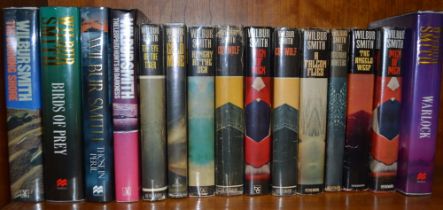 A collection of Wilber Smith novels mainly first editions to include seven signed examples