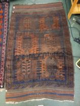 A 19th century woven woollen floor rug with six stylised trees 112 x 142 cm