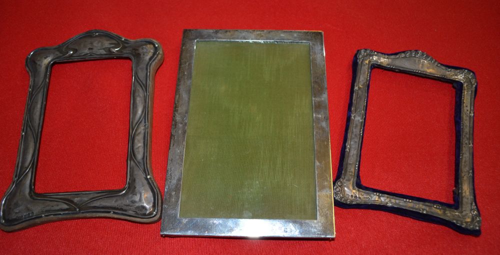 Three silver picture frames