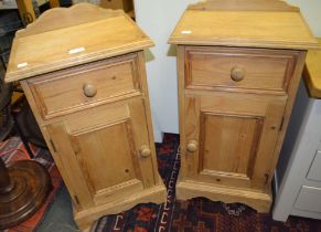 A pair of good quality pine bedside cupboards