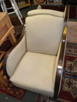 A pair of oak framed 'Art Deco' armchairs with neutral upholstery