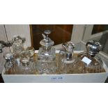 A collection of silver topped perfume bottles (9)