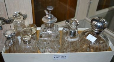 A collection of silver topped perfume bottles (9)