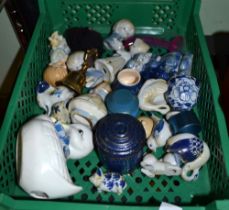 A plastic tray of small porcelain and china collectibles