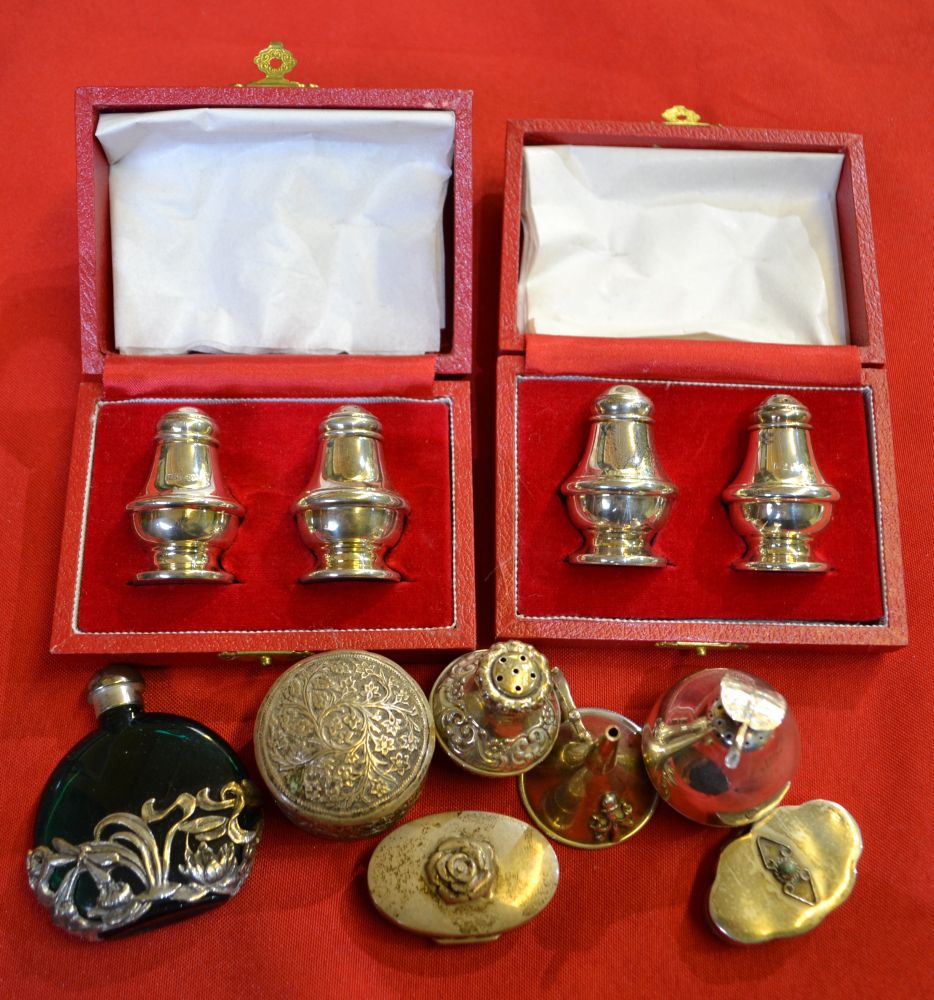 A selection of silver boxes, condiments, etc.