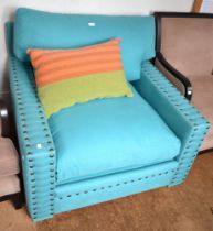 A modern square design aqua marine upholstered large arm chair