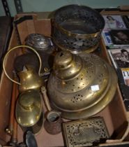 A box containing a selection of decorative brass and metal wares