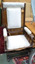 An American cream upholstered rocking chair