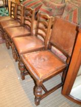 A set of five single ladder back dining chairs, with studded seats