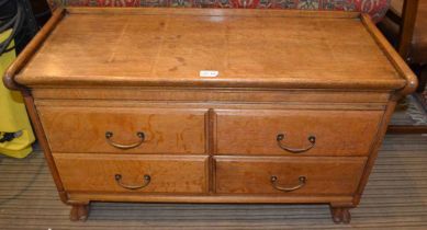 An oak cabinet fitted four drawers, raised on carved claw paw front feet, 87cm wide