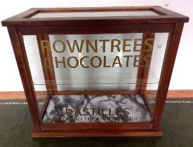 A reproduction glass display cabinet bearing the inscription, "Rountree's Chocolate" 45cm wide