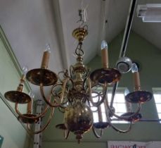 A large modern brass eight arm chandelier