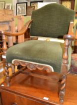 A small green upholstered show-wood armchair